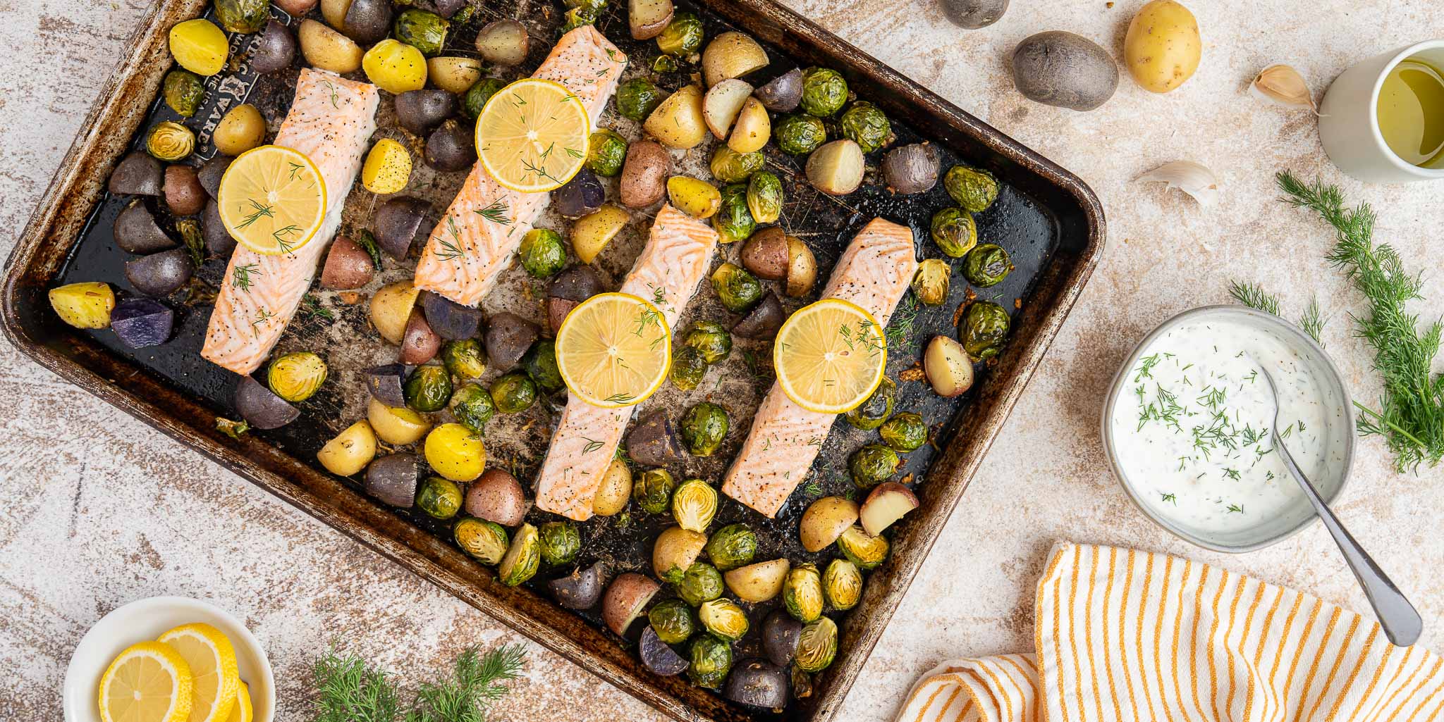 Baked Salmon with Veggies and Lemon Dill Sauce